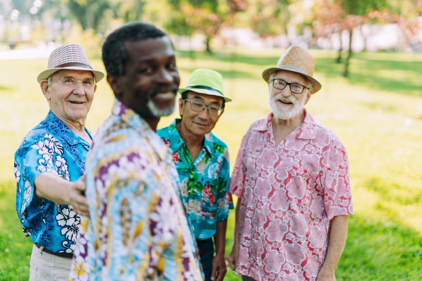 A group of older men enjoying time together outdoors.