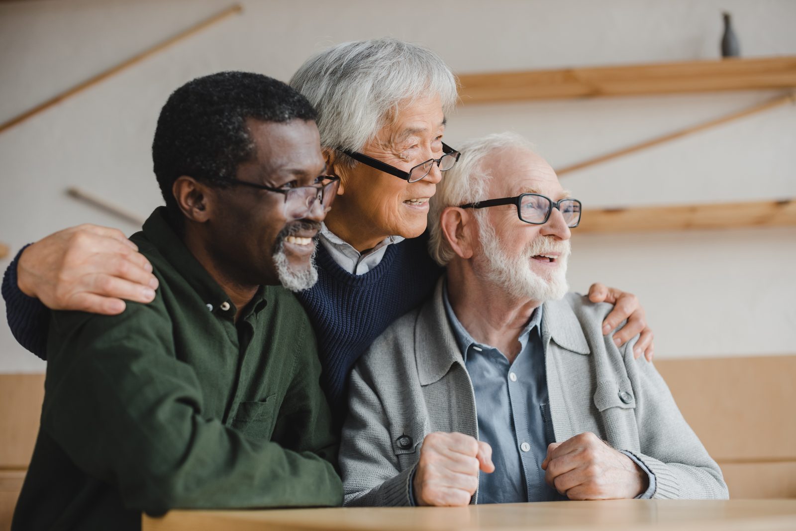 A group of older men in conversation together.